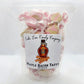Mellow Monkey Maple Bacon Taffy, a unique sweet and salty candy with pink and tan swirls, individually wrapped.