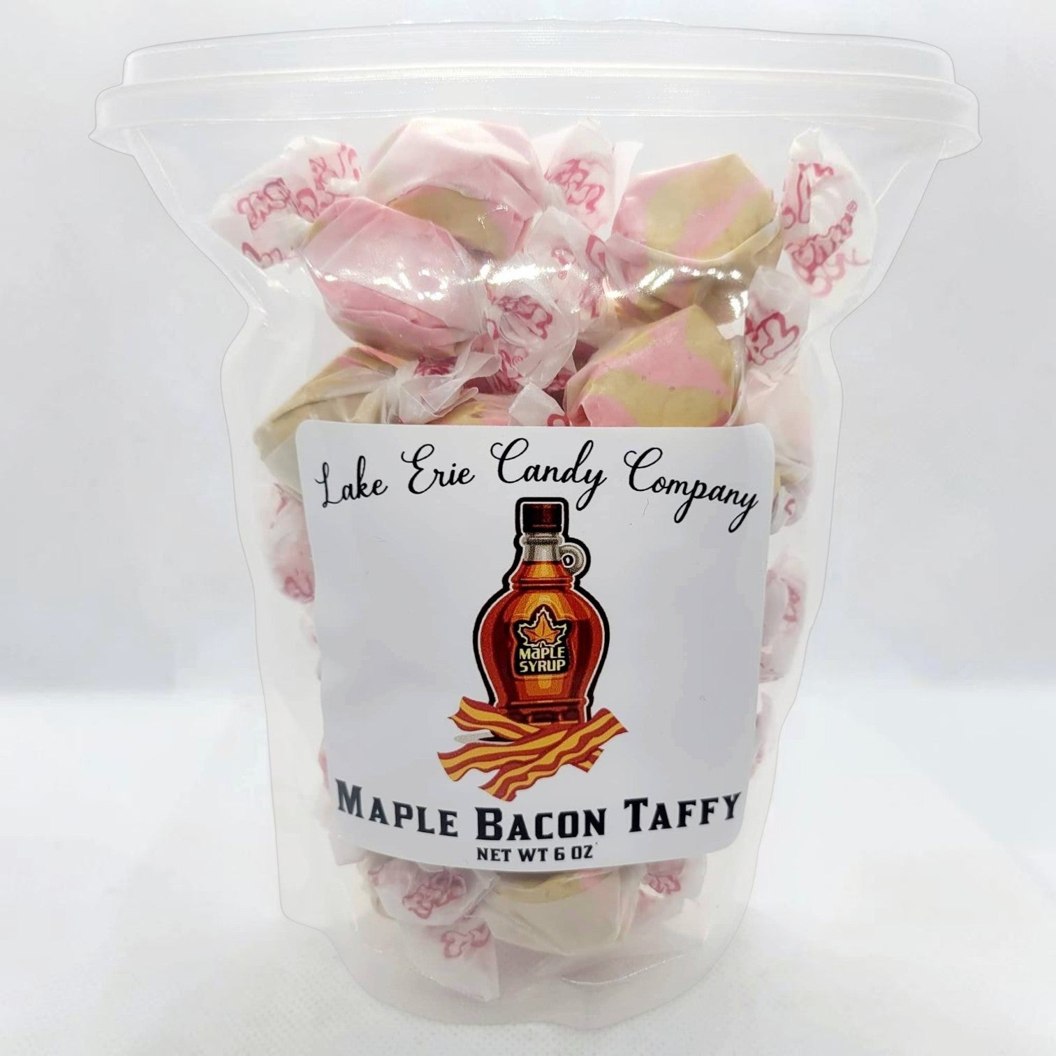 Mellow Monkey Maple Bacon Taffy, a unique sweet and salty candy with pink and tan swirls, individually wrapped.