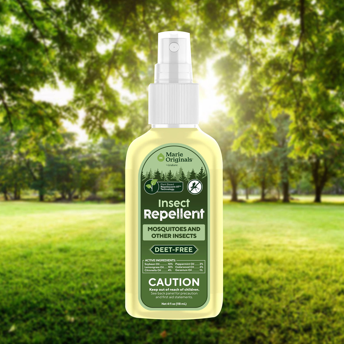 Mellow Monkey Marie Originals plant-based DEET-free insect repellent spray bottle in a sunny outdoor forest setting.