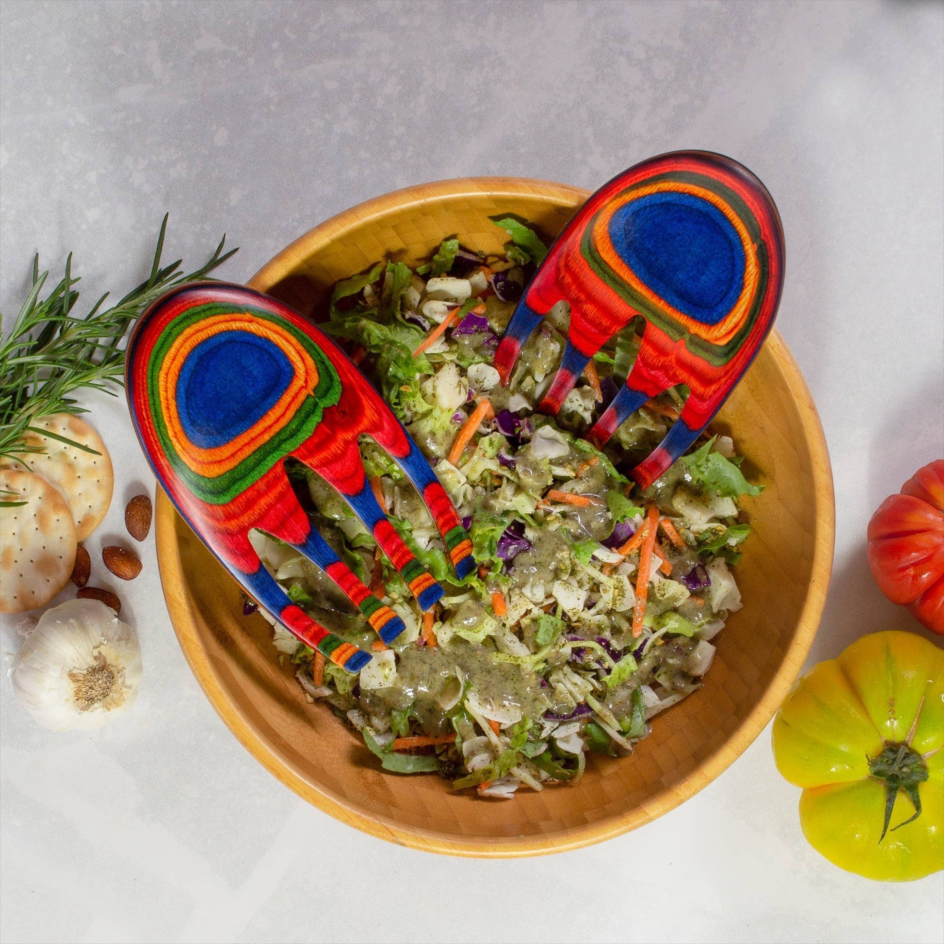 Mellow Monkey Marrakesh Salad Hands in vibrant rainbow wood, shaped like hands for easy salad tossing. Ergonomic design with a back knob.