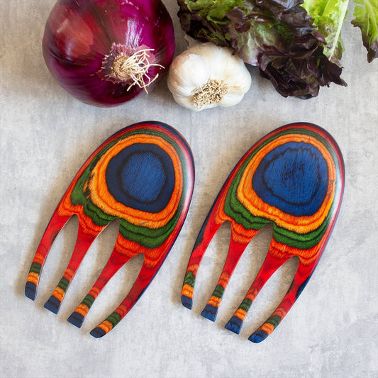 Mellow Monkey Marrakesh Salad Hands, ergonomic wooden salad servers with vibrant blue, orange, green, and red peacock feather design.