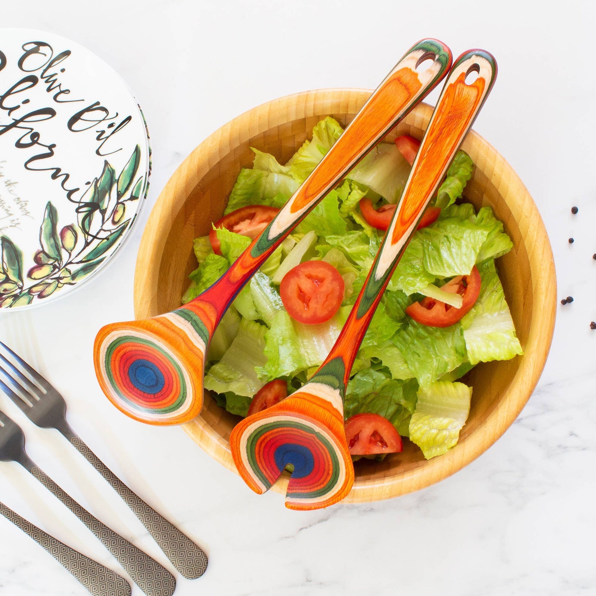 Mellow Monkey Marrakesh Collection layered birch salad serving utensil set with colorful concentric circles.