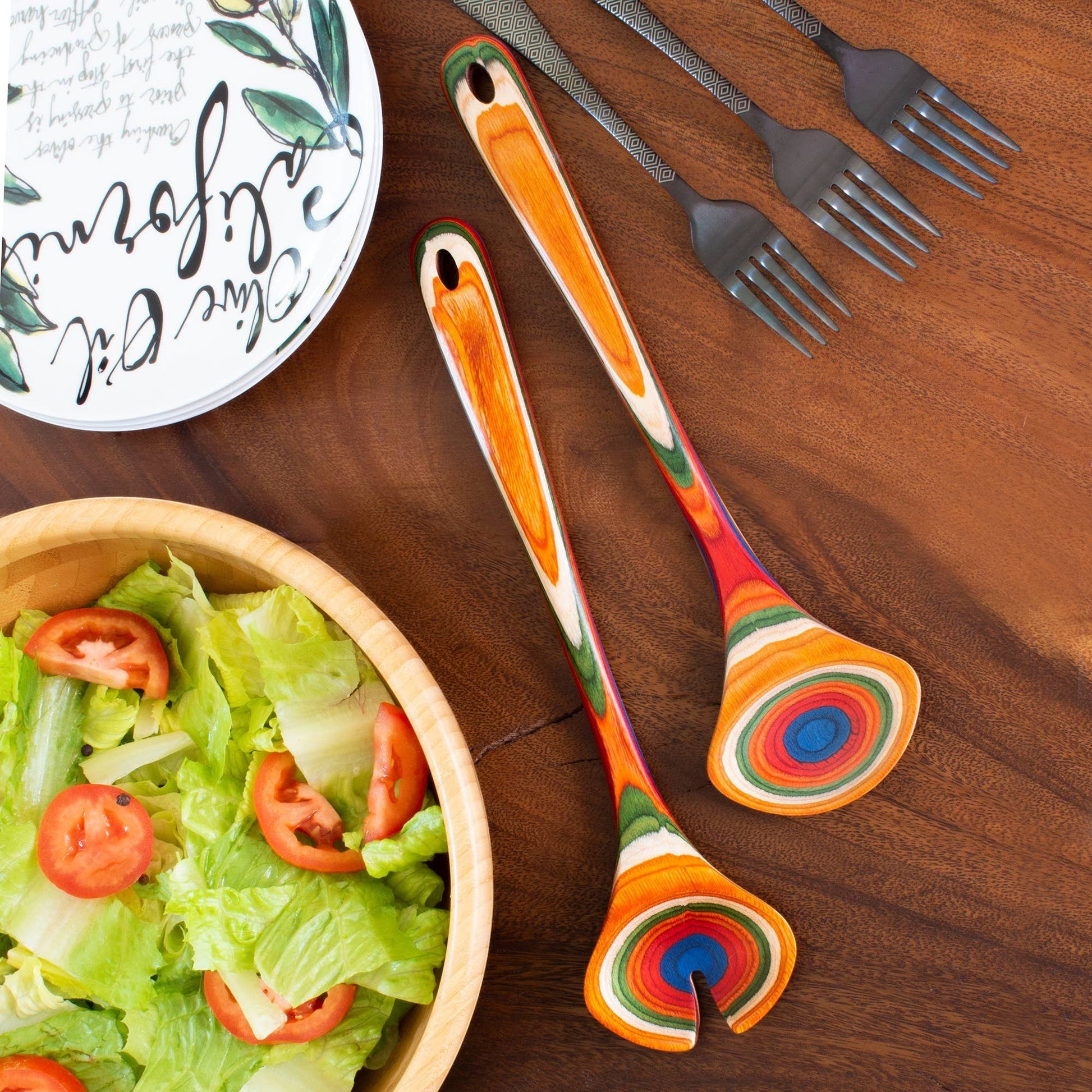 Mellow Monkey Marrakesh Collection salad serving utensil set, made of layered birch wood with vibrant rainbow colors.