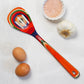Mellow Monkey Marrakesh Collection wooden slotted spoon with colorful swirls of red, blue, green, and orange. 12.5-in.