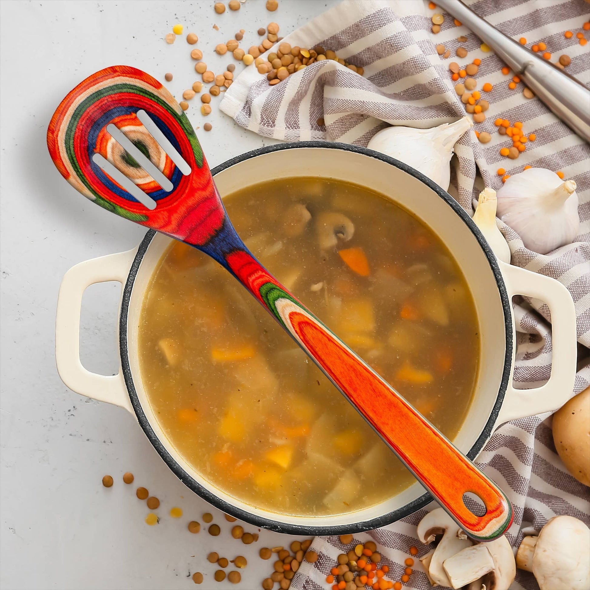 Mellow Monkey Marrakesh Collection wooden slotted spoon with colorful swirls, 12.5-in