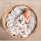 Mellow Monkey Maryland themed muslin baby swaddle blanket featuring state flag, crab, and oriole print on a newborn.