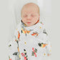 Mellow Monkey Maryland themed muslin swaddle blanket featuring state flag, crab, and oriole print wrapped on a baby.