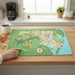 Mellow Monkey Maryland map tea towel with original artwork, featuring towns, attractions, an oriole bird, and flowers. 100% cotton.