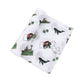 Mellow Monkey Massachusetts themed muslin baby swaddle blanket with state icons, whales, and clovers on white fabric.