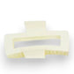 Mellow Monkey jumbo matte cream rectangle hair claw with a cut-out design for secure styling.