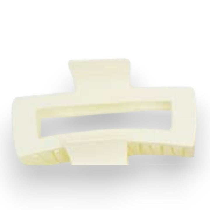Mellow Monkey jumbo matte cream rectangle hair claw with a cut-out design for secure styling.