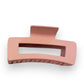 Mellow Monkey jumbo matte dusty pink rectangle hair claw with a cut-out design for secure styling.