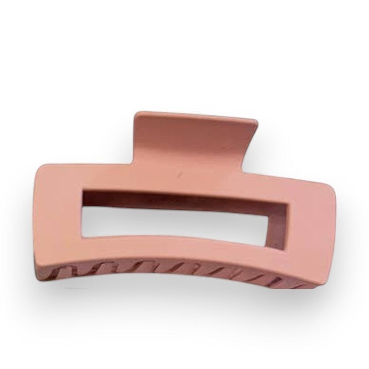 Mellow Monkey jumbo matte dusty pink rectangle hair claw with a cut-out design for secure styling.