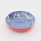Mellow Monkey large melamine bowl with a blue interior featuring a "Race Day" sailboat print and a coral exterior. Dishwasher safe.