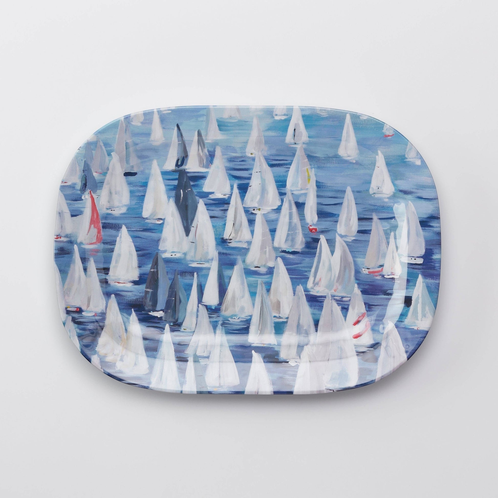 Mellow Monkey large melamine platter with a "Race Day" design of many white sailboats on blue water.