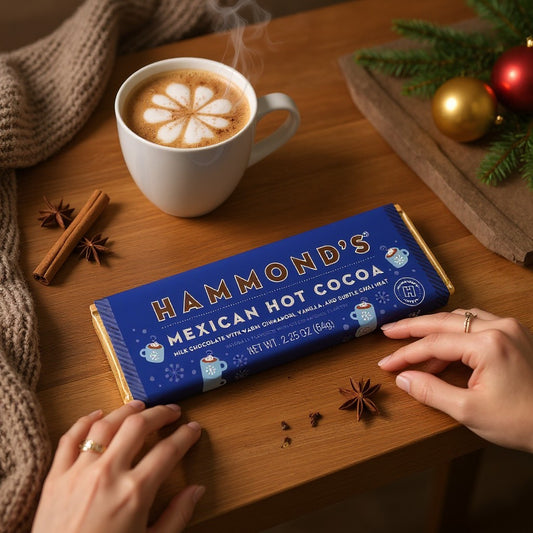 Mellow Monkey Mexican Hot Cocoa milk chocolate bar with cinnamon and chili, displayed with a steaming mug of cocoa.