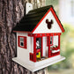 Mellow Monkey Mickey Cottage Birdhouse with Mickey Mouse graphic, red trim, white walls, and black roof. Features Mickey ears cutout.