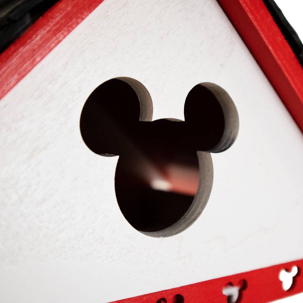 Mellow Monkey Mickey Cottage birdhouse, white with red trim and Mickey Mouse shaped entrance hole. Features cleanout, drainage, and ventilation.