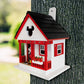 Mellow Monkey Mickey Cottage birdhouse with red trim, black roof, and Mickey Mouse ears cutout. Features a porch with Mickey Mouse figure.