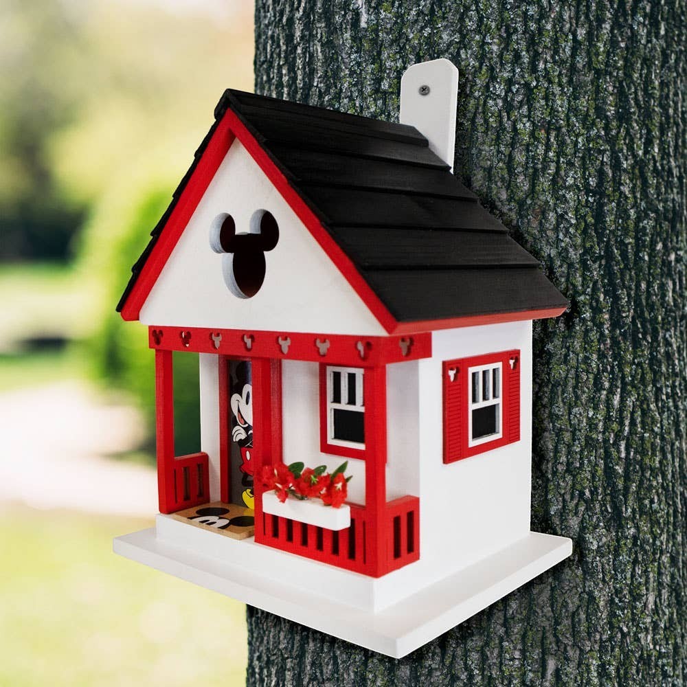 Mellow Monkey Mickey Cottage birdhouse with red trim, black roof, and Mickey Mouse ears cutout. Features a porch with Mickey Mouse figure.