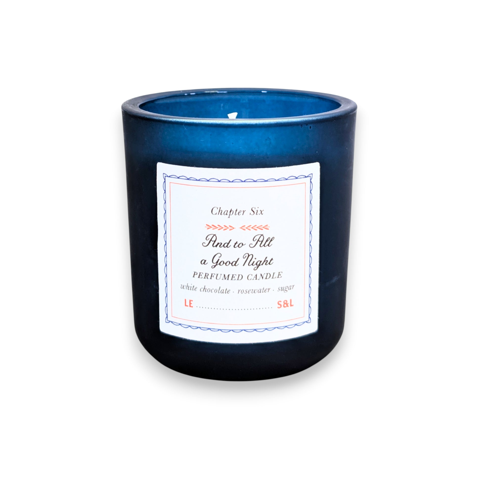 Mellow Monkey And to All a Good Night scented candle in a deep midnight blue glass vessel with a storybook label.