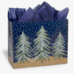 Mellow Monkey large gift bag with midnight snowfall and pine tree print, glossy finish, and dark blue tissue paper.