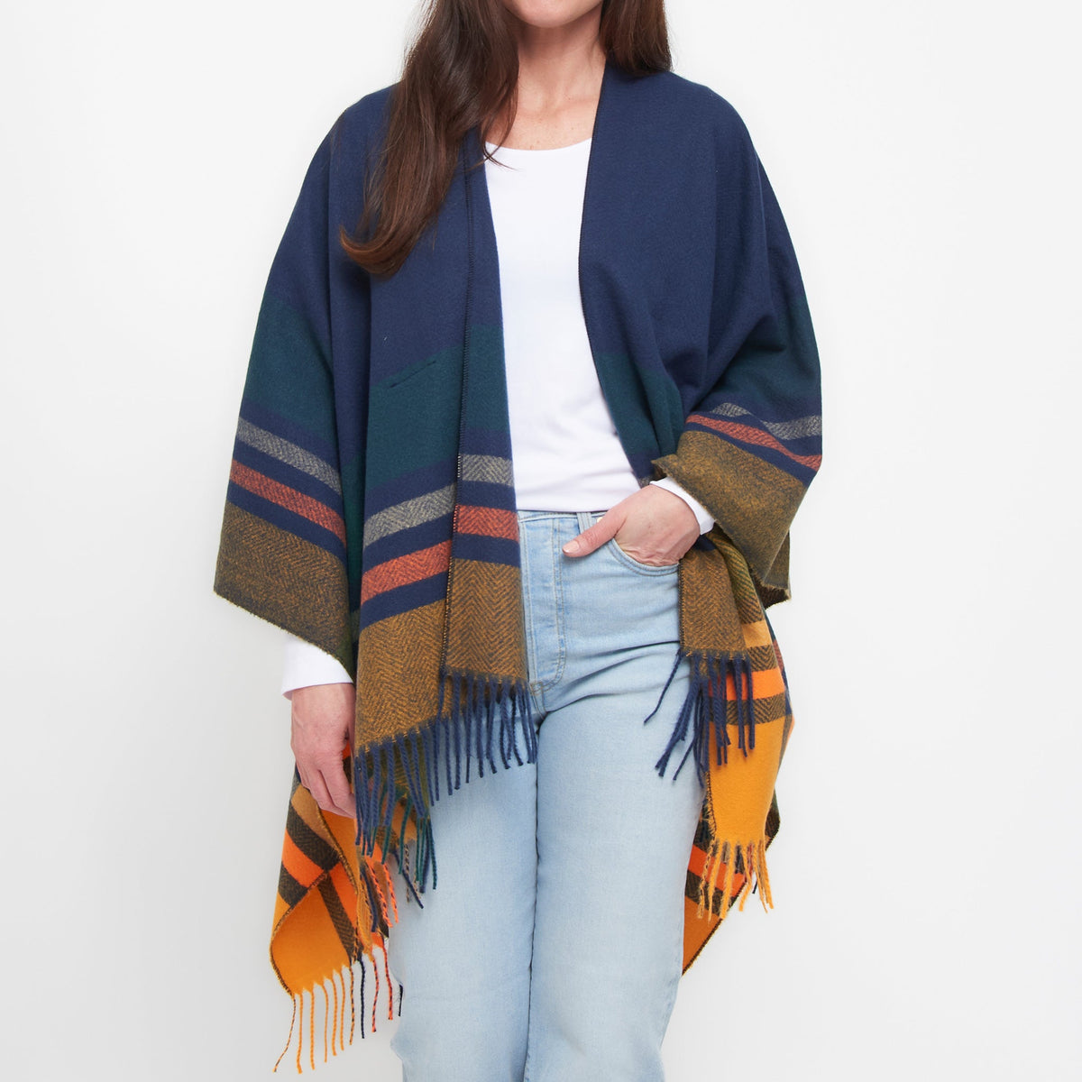Mellow Monkey Sidney fringe wrap in midnight plaid with tassel accents and loop closure worn over a white top