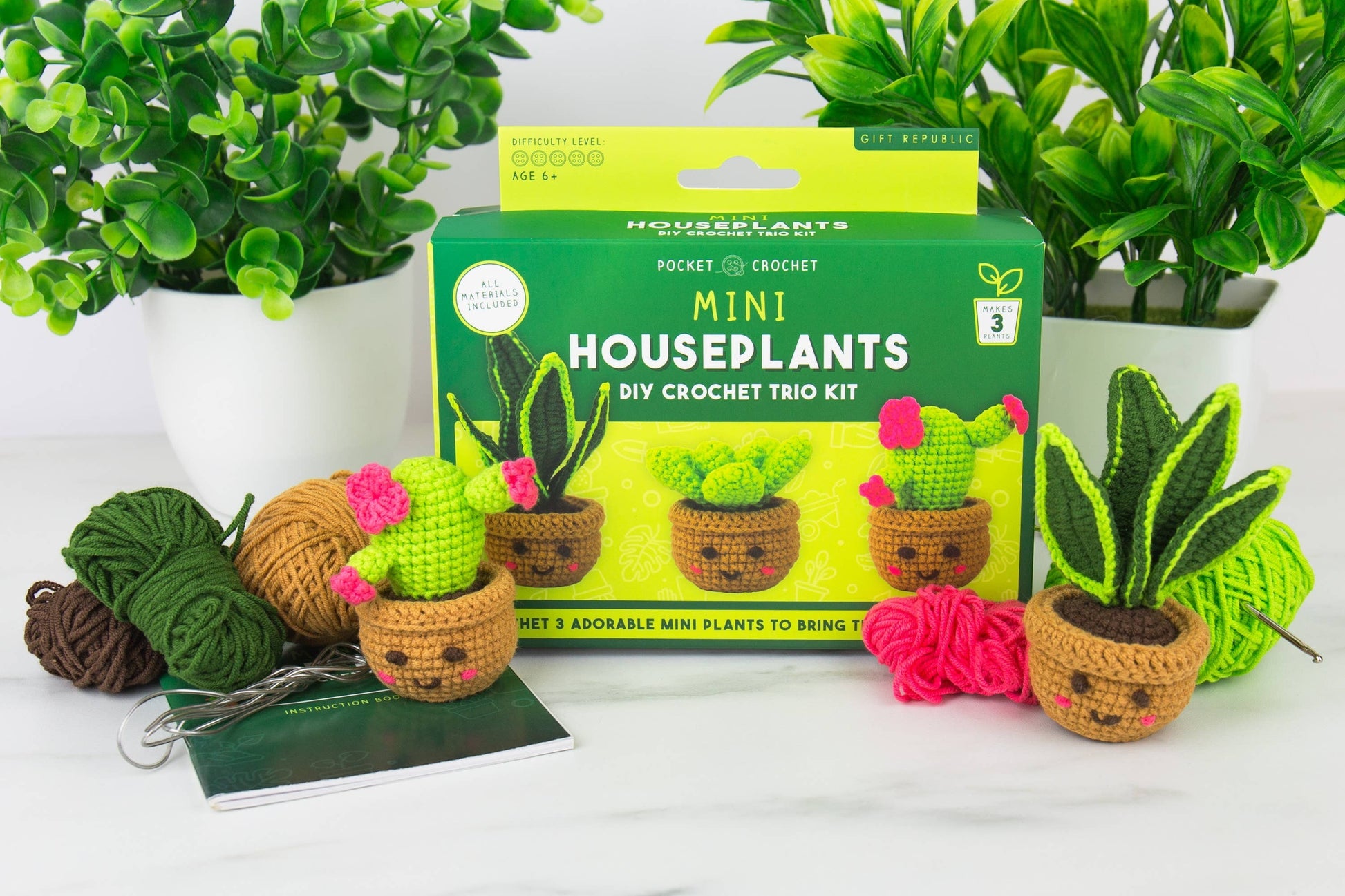 Mellow Monkey Pocket Crochet Mini Houseplants DIY kit with yarn, crochet hook, and finished cute potted plant figures.
