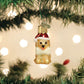 Mellow Monkey Mini Jolly Pup blown glass holiday ornament with red Santa hat and white scarf.