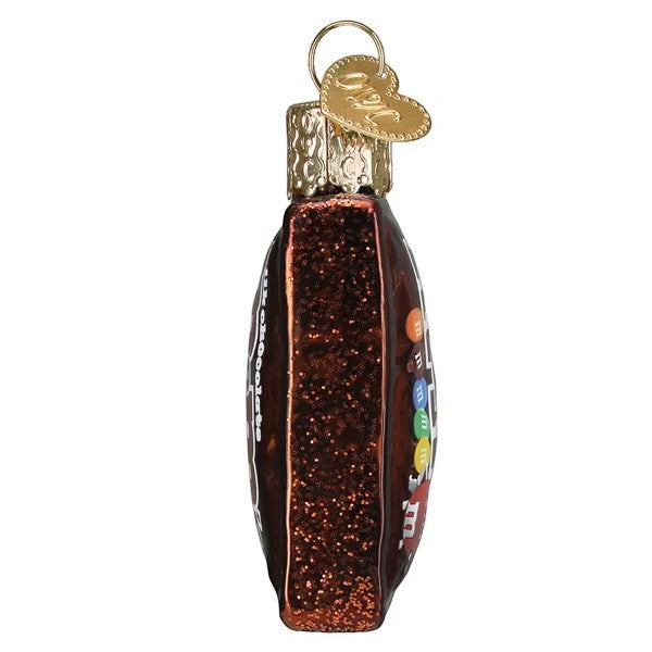 Mellow Monkey Mini M&M'S bag blown glass holiday ornament, brown with glitter and colorful M&M candies.