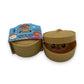 Mellow Monkey Mini Mystery Dumpling squishy toy in a golden glitter finish inside a plastic bamboo-style steamer basket.