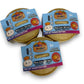 Three Mellow Monkey Mini Mystery Dumpling squishy toys in individual bamboo-style steamer baskets with colorful labels.