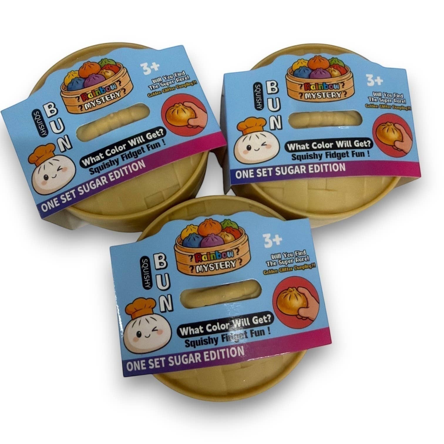 Three Mellow Monkey Mini Mystery Dumpling squishy toys in individual bamboo-style steamer baskets with colorful labels.
