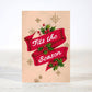 Mellow Monkey mini Christmas card featuring a red ribbon with holly berries and the text Tits the Season