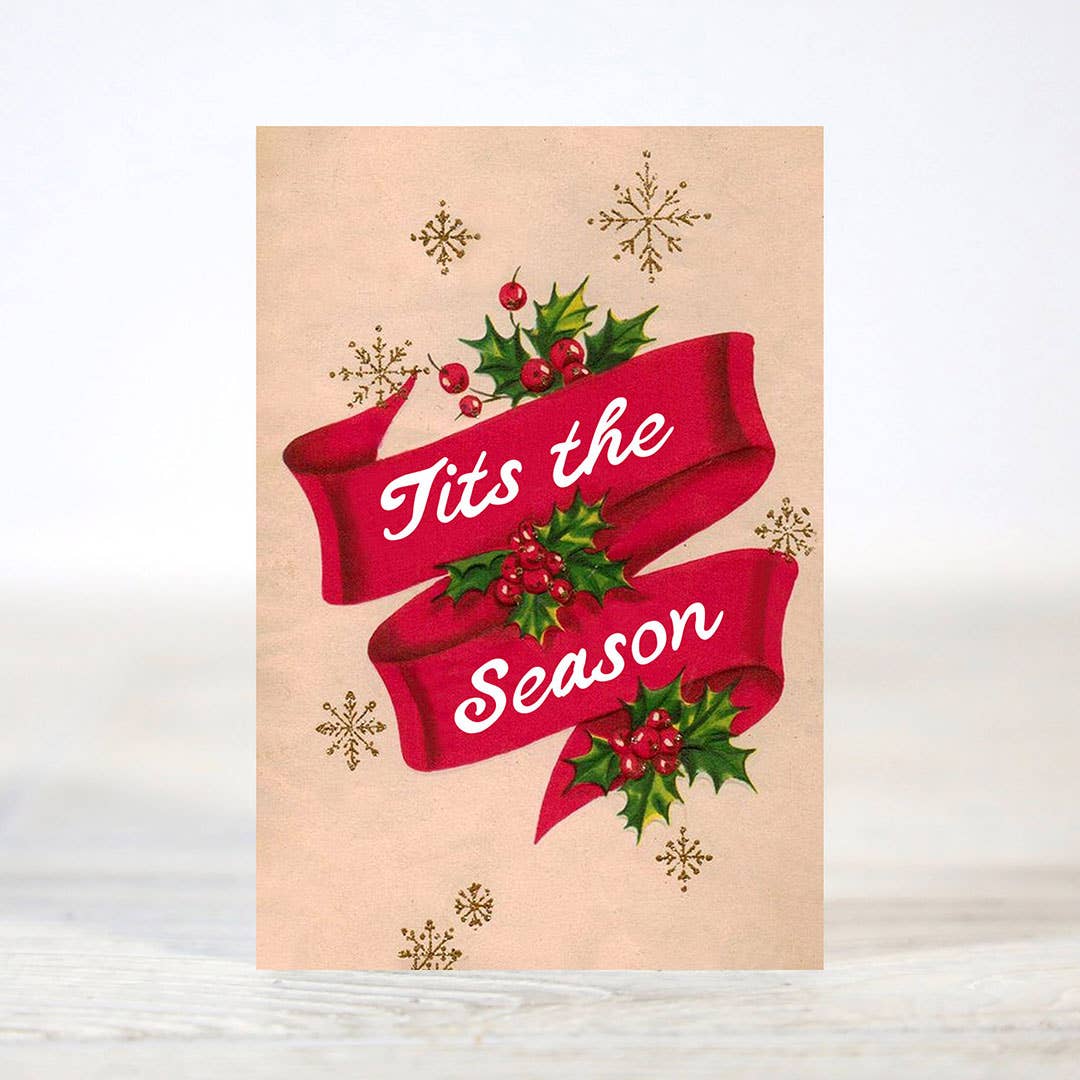 Mellow Monkey mini Christmas card featuring a red ribbon with holly berries and the text Tits the Season