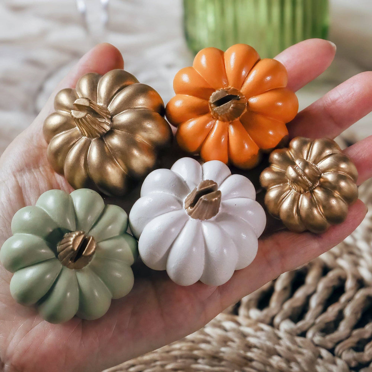 Mellow Monkey set of assorted miniature pumpkin place card holders in orange, gold, white, and sage green.