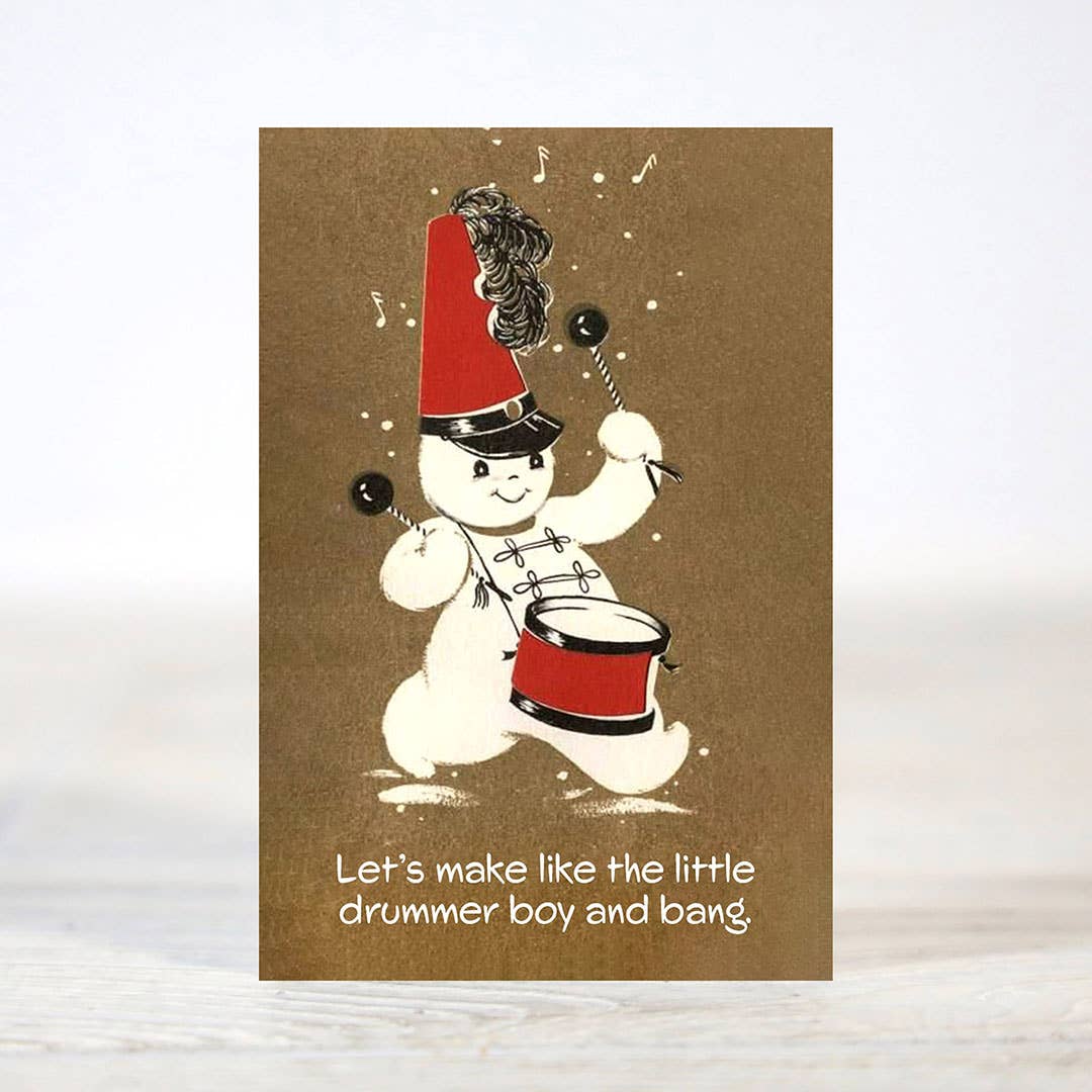 Mellow Monkey mini Christmas card featuring a vintage-style snowman drummer with red hat and drum on brown paper