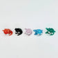 Mellow Monkey set of five miniature handblown glass cats in orange, black, pink, blue, and green with whimsical eyes.