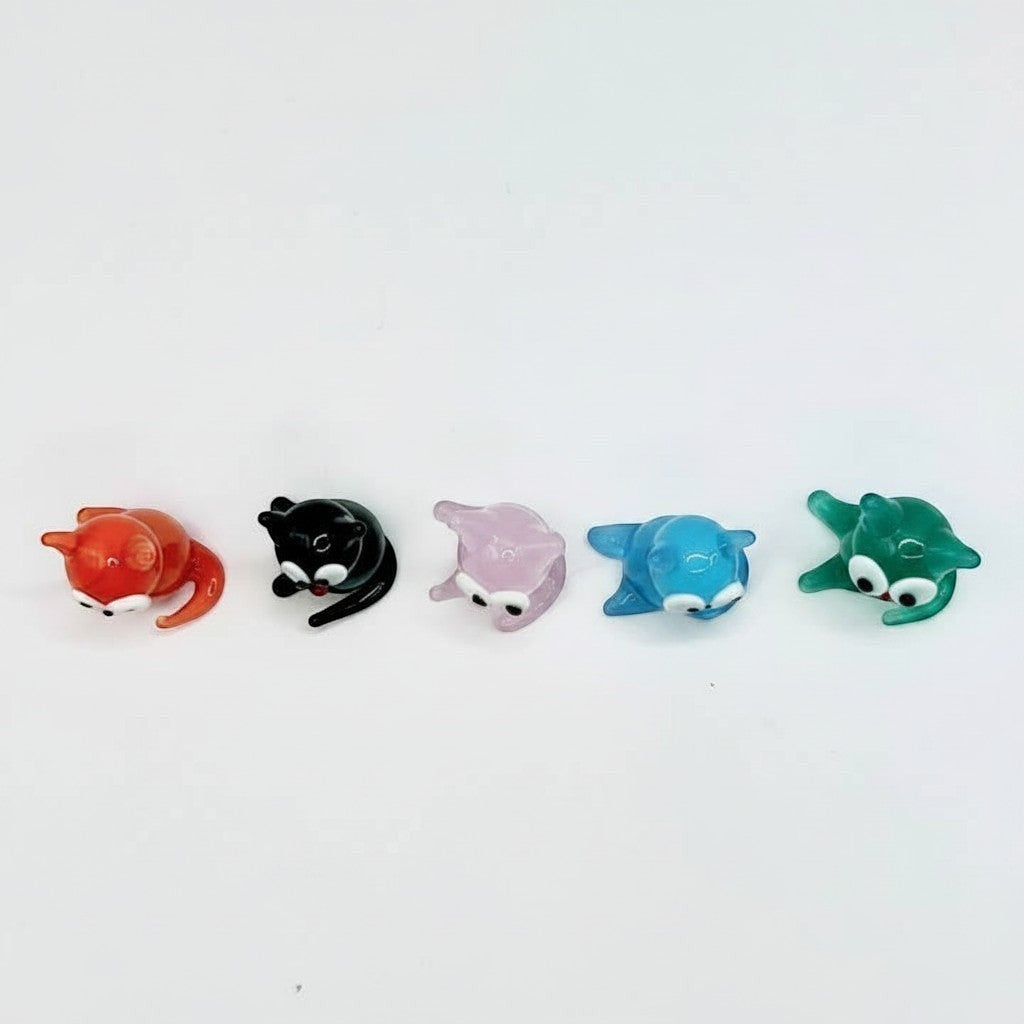Mellow Monkey set of five miniature handblown glass cats in orange, black, pink, blue, and green with whimsical eyes.