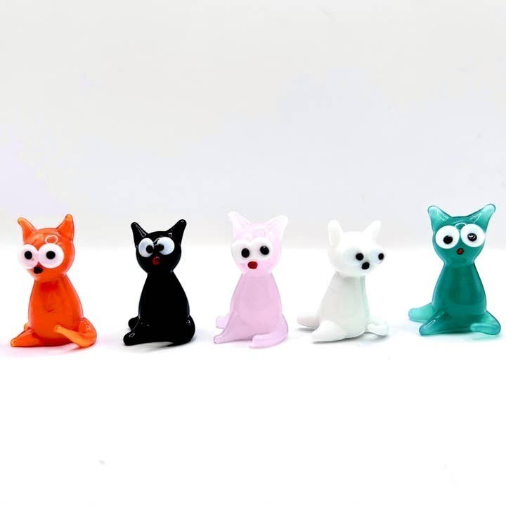 Mellow Monkey set of five miniature handblown glass cats in orange, black, pink, white, and greenish-teal colors.