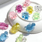Mellow Monkey 12-pack of miniature jelly-soft squishy turtles in assorted translucent colors on a white plate.