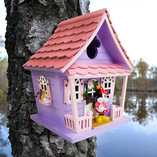 Mellow Monkey Minnie Icon Pink Birdhouse with Minnie Mouse figure on porch. Purple house with pink roof, windows, and trim.