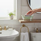 Mellow Monkey mint green iron bathtub soap dish with white rim and claw feet, 5.5" wide