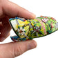 Mellow Monkey flexible 3D Mississippi state-shaped souvenir magnet held in hand showing colorful landmarks and cities