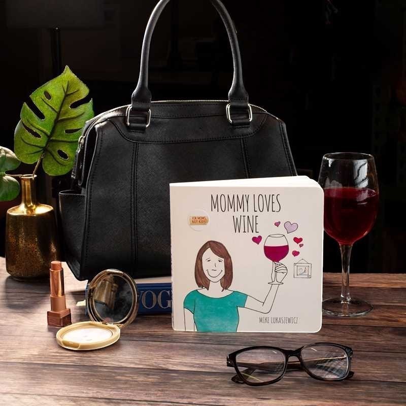 Mellow Monkey Mommy Loves Wine humorous hardcover book for moms, featuring a whimsical illustration and a glass of red wine.