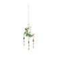 Mellow Monkey moon-shaped suncatcher with green healing stones, gold chains, and hanging crystal prisms.