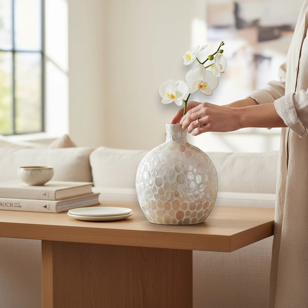 Mellow Monkey 20-inch round bottleneck vase crafted from iridescent mother of pearl mosaic tiles on a wooden table.
