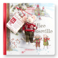 Mellow Monkey Mouseville storybook and felted Finn mouse ornament wearing a red sweater and plaid pants.