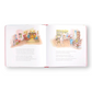 Mellow Monkey Mouseville storybook open to illustrated pages showing mice characters in a cozy Christmas home setting