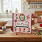 Mellow Monkey Craft Along with Mrs. Claus holiday activity book on a wooden table with Christmas cookies